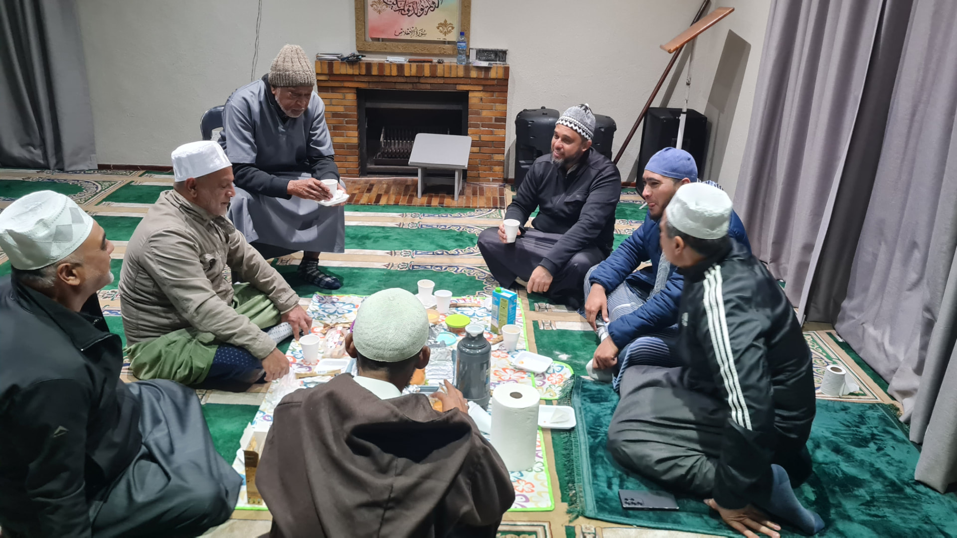 Volunteers clearing the Masjid land together
