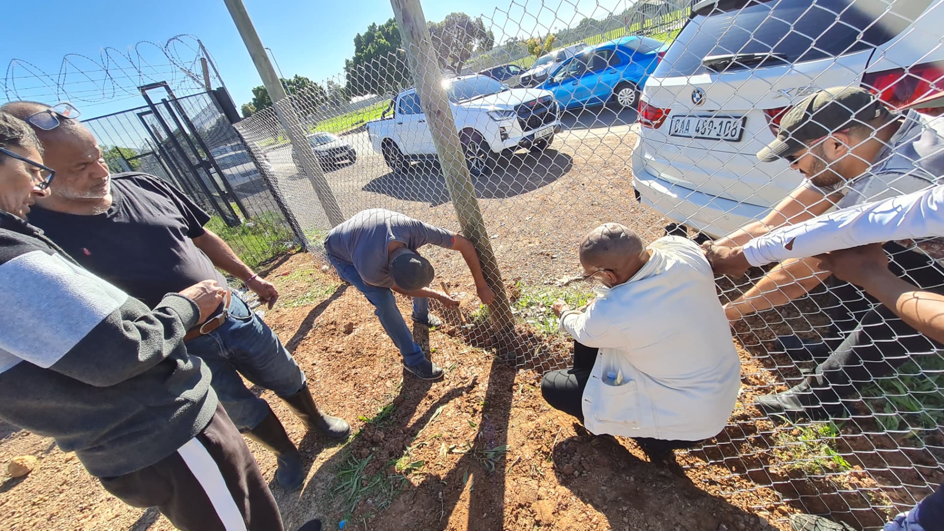 Community members working together on the masjid grounds